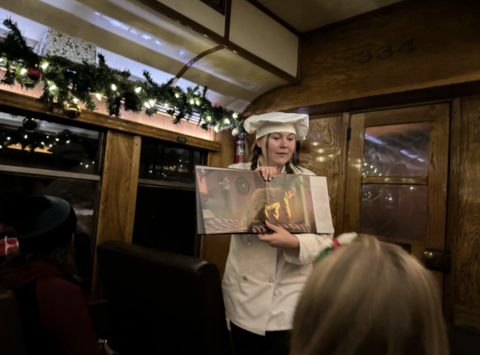 Sydney Vassar, senior at Durango High School, reading the Polar Express while on the Durango Silverton Narrow Gauge Railroad train. Courtesy of Morgan Kraska. 
